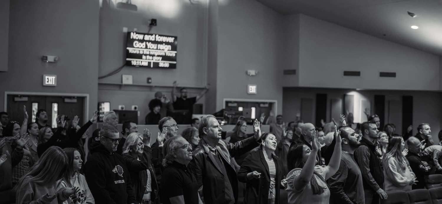 Church attendees engaging in worship
